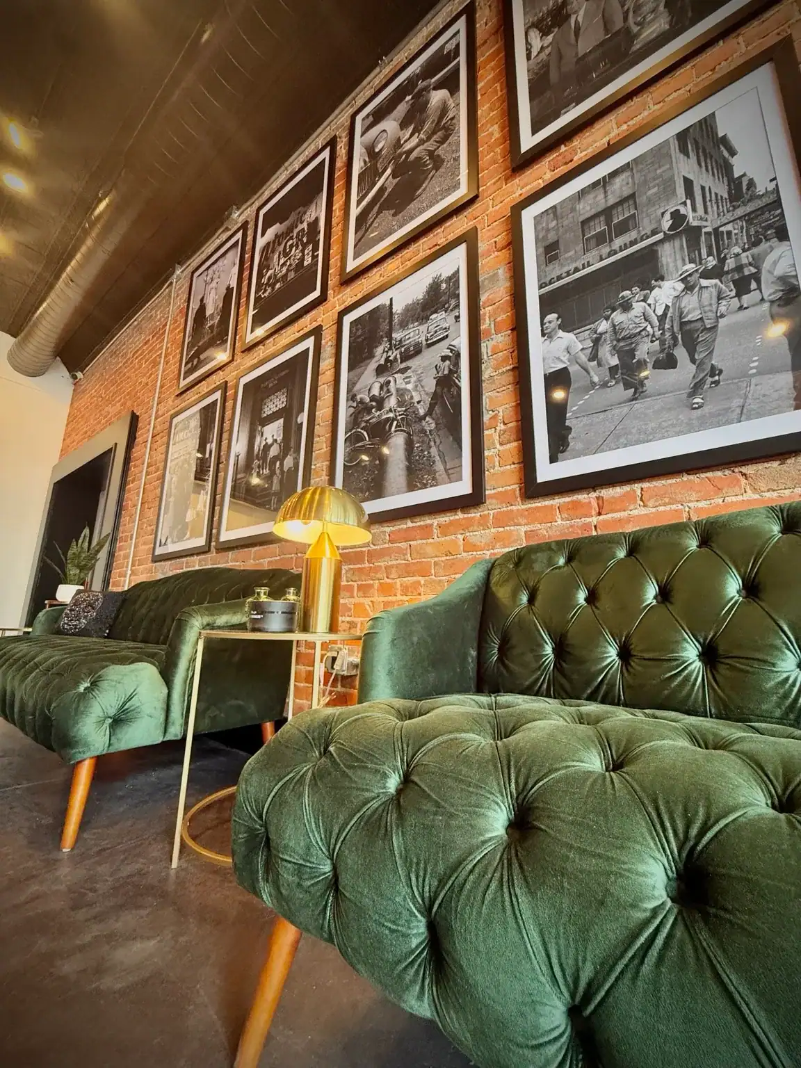 Green velvet lounge seating and historic Paducah photographs