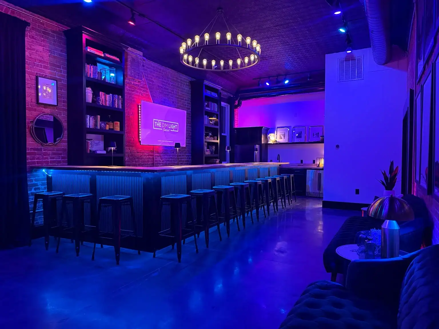 The bar illuminated in blue and violet for an evening event